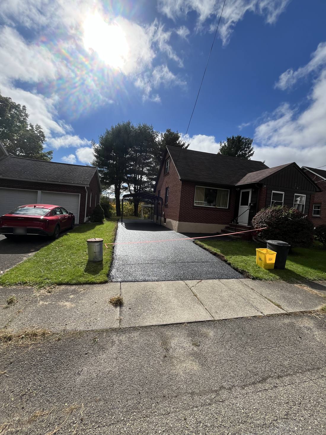 Freshly finished driveway at a brick house