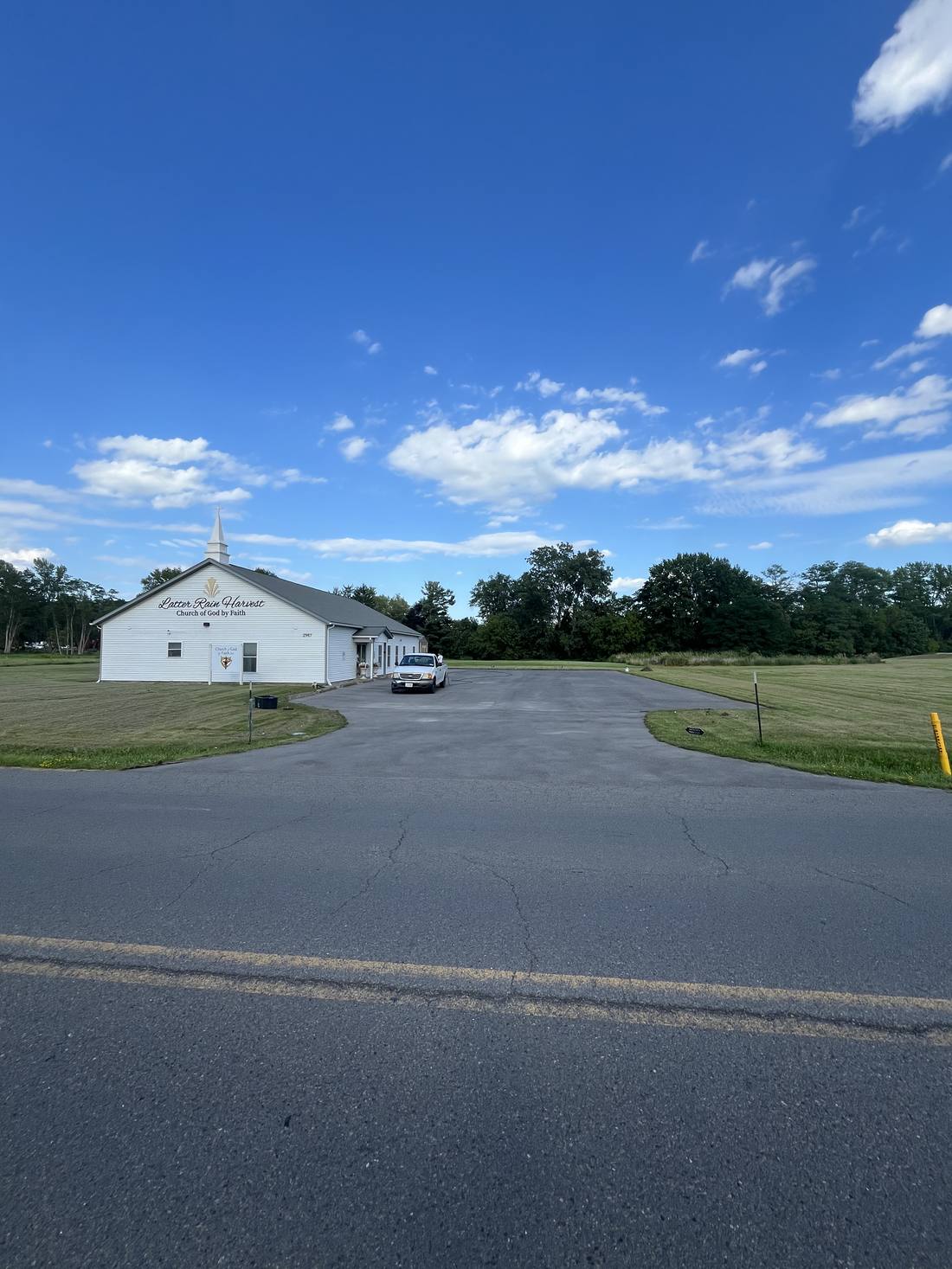 Church parking lot before, faded and gray